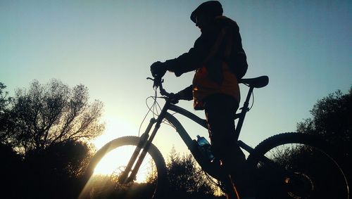 Silhouette of woman against sky