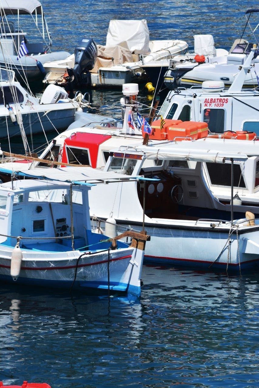 nautical vessel, moored, boat, water, transportation, mode of transport, sea, waterfront, harbor, sailboat, day, mast, travel, outdoors, rippled, no people, nature, in a row, group of objects, tranquility