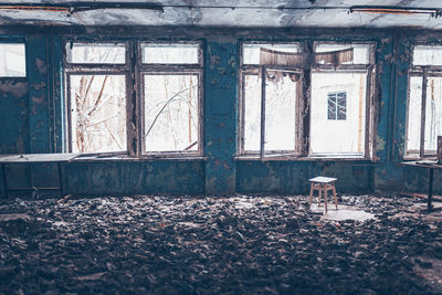 Broken window of abandoned house