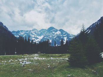 Scenic view of snowcapped mountains against sky