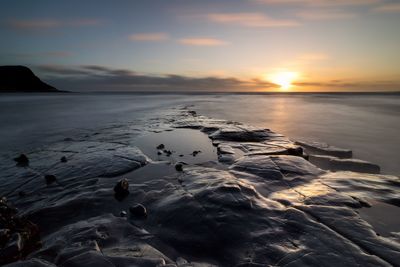 Scenic view of sea against sky during sunset