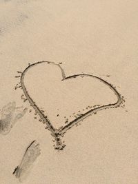 Heart shape on sand at beach