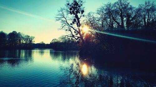 Scenic view of lake against sky during sunset