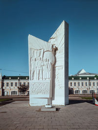 Statue of building against blue sky