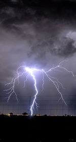 Low angle view of lightning at night