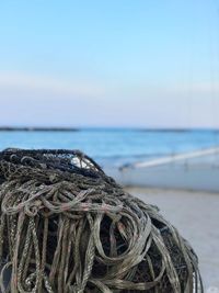 Close-up of fishing net on beach