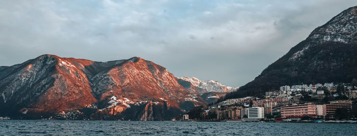 Panoramic view of sea and buildings against sky