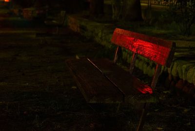 Close-up of red seat on field