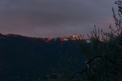 Scenic view of mountains against sky at sunset