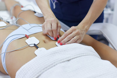 Midsection of woman holding hands