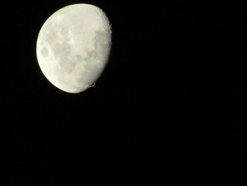 Low angle view of moon against clear sky at night