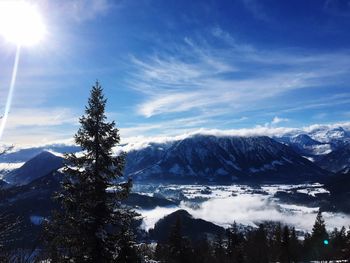 Scenic view of snow covered mountains against sky