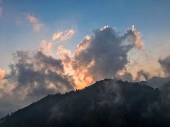 Low angle view of mountain against sky during sunset