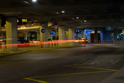 Light trails on road in city at night