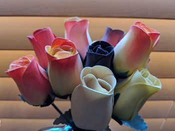 Close-up of pink roses on table at home