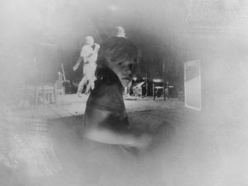 Woman standing in bathtub