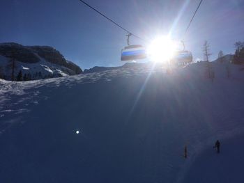 Overhead cable car against sky during winter