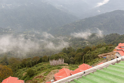 High angle view of houses and trees on mountain