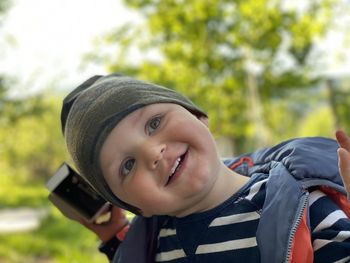 Smiling cute baby boy looking away