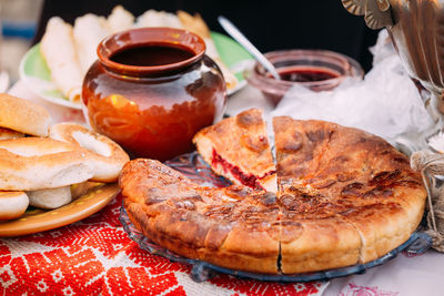 Close-up of food in plate by container on table