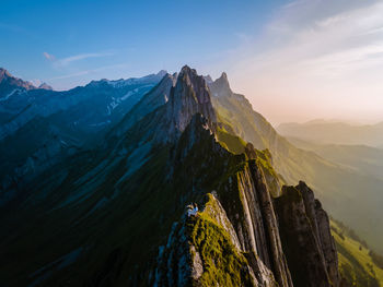 Panoramic view of snowcapped mountains against sky