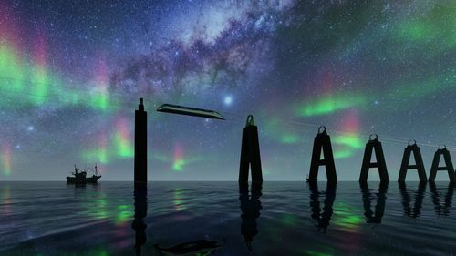 Scenic view of sea against sky at night