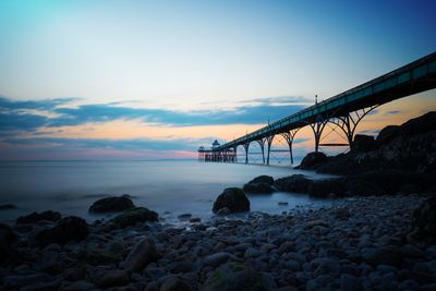 Bridge over sea against sky