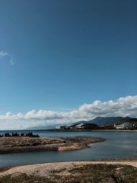 Scenic view of sea against blue sky