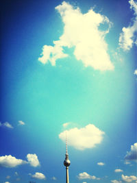 Low angle view of tower against cloudy sky