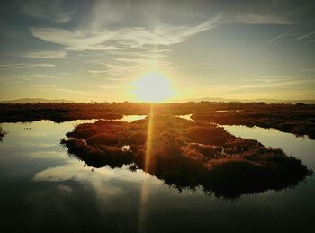 Scenic view of lake at sunset