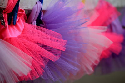 Row of tutus on display at market stall