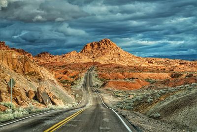 Panoramic view of road amidst mountains against sky