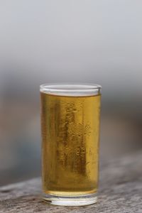 Close-up of beer glass on table