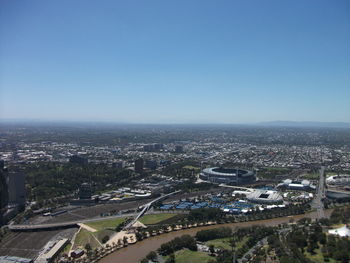 High angle view of city buildings against clear sky