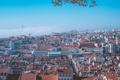 High angle shot of townscape against blue sky