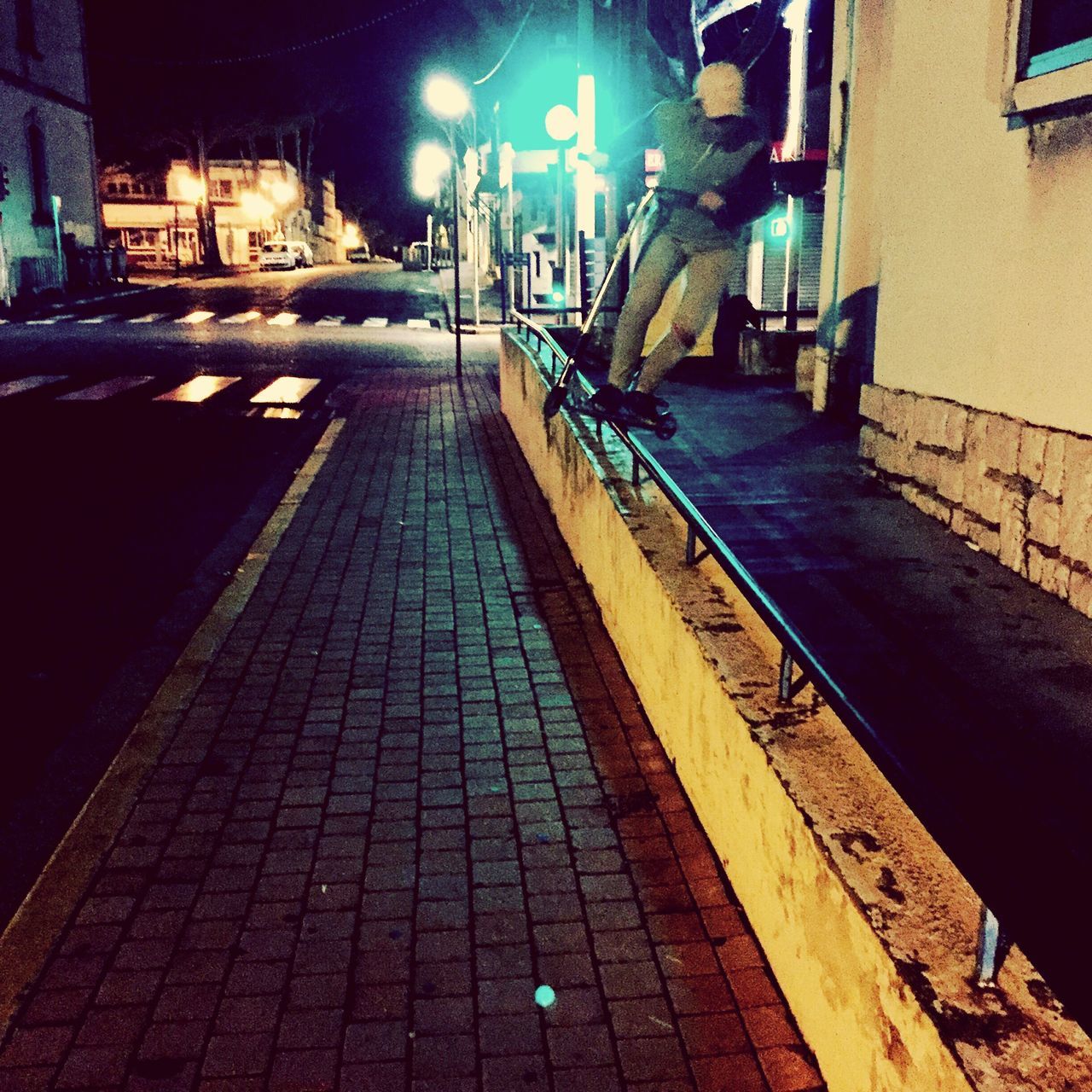 night, illuminated, the way forward, built structure, architecture, building exterior, street light, cobblestone, street, lighting equipment, diminishing perspective, empty, walkway, city, narrow, vanishing point, sidewalk, paving stone, footpath, outdoors