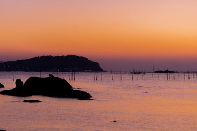 Scenic view of sea against sky during sunset