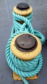 High angle view of rope tied at harbor