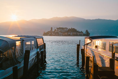 View of the san giulio island on lake orta at sunset