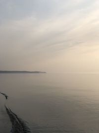 Scenic view of sea against sky at sunset