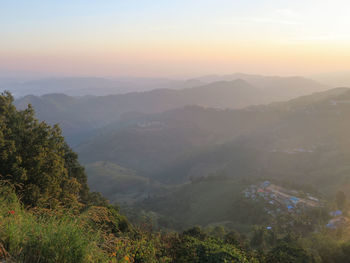 High angle view of mountains against sky during sunset