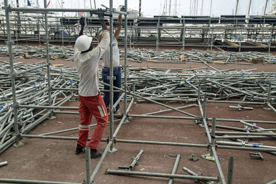 Rear view of man working at construction site