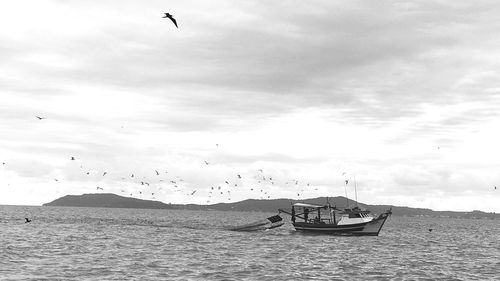 Boat in sea against sky