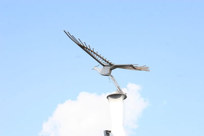 Low angle view of wind turbine against sky