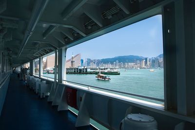 Panoramic view of city by sea against sky