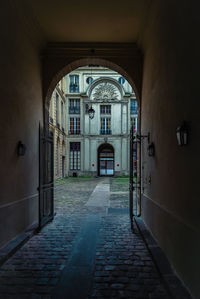 Alley amidst buildings in city