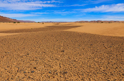 Scenic view of desert against sky