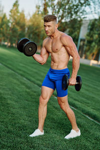 Low section of man exercising in gym