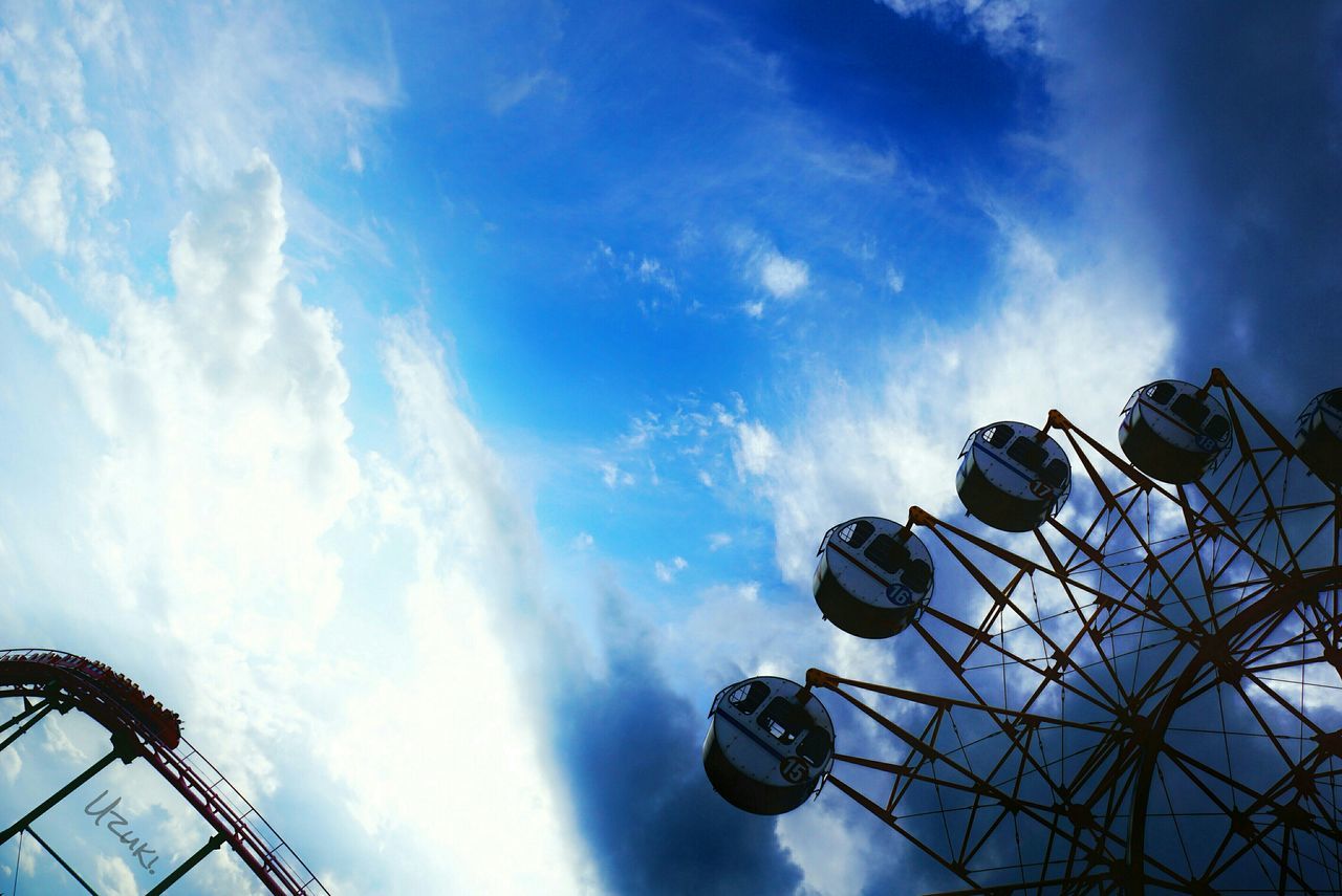 LOW ANGLE VIEW OF FERRIS WHEEL AGAINST CLOUDY SKY