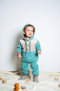 Baby fashion. unisex clothes for babies. cute baby in cotton set suit on light background.